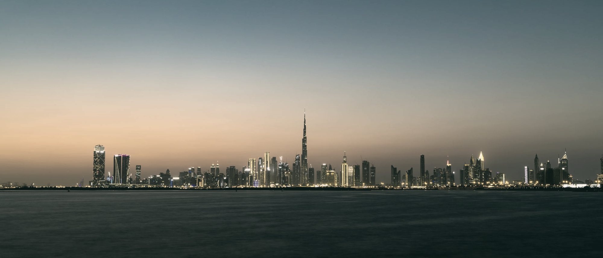 The Dubai skyline at dusk.